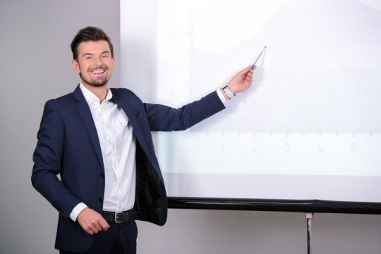 Business conference Young businessman giving presentation to his colleagues